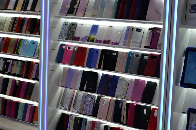 accessories, case, cell phone, phone, electronics, store, display, sale, technology, android, apple, iphone, tablet, mobile, smart phone, shelves, led, 2023, 2024, selection of phone covers, galleria mall, accessory, shelf, selection, array. Retail technology procurement